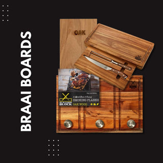 Set of premium oak braai boards with cutting tools and instructional guide for outdoor cooking.