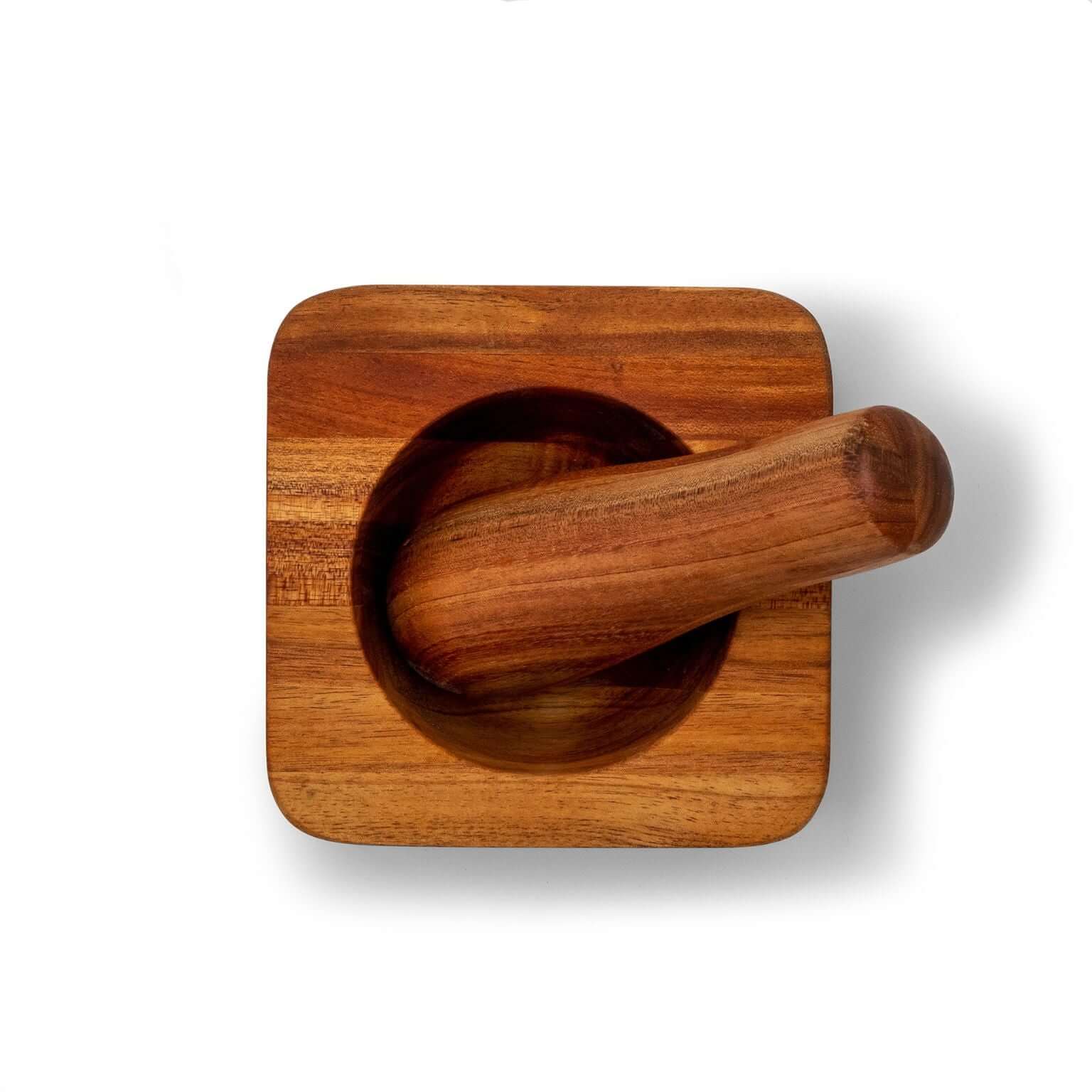 Acacia wood pestle and mortar from above, perfect for grinding and blending spices and herbs.
