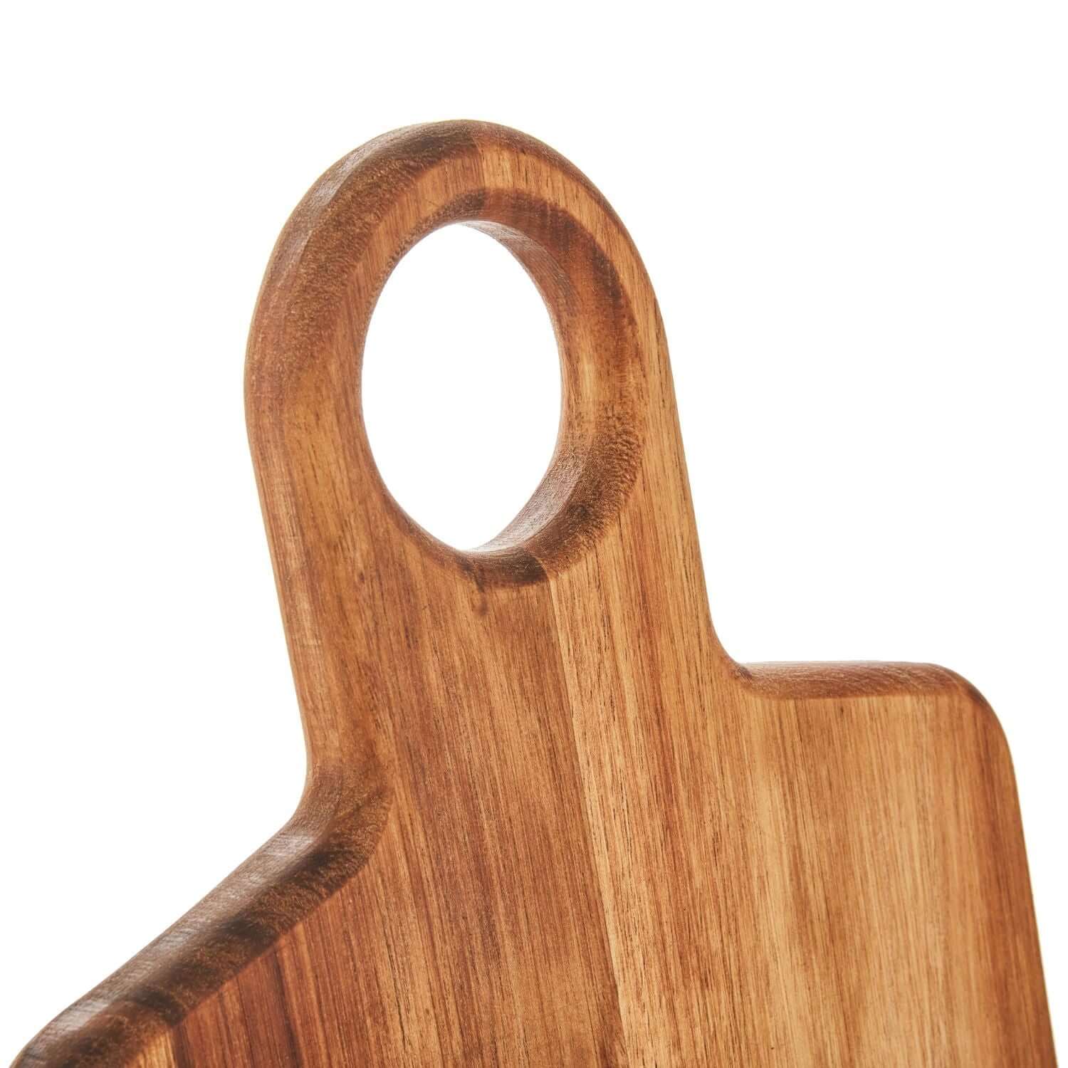 Close-up of Paddle Board Large showing round handle and smooth wooden surface, ideal for food prep and serving.