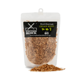 A clear bag of cedar wood shavings for smoking food, showcasing rich texture and aroma.
