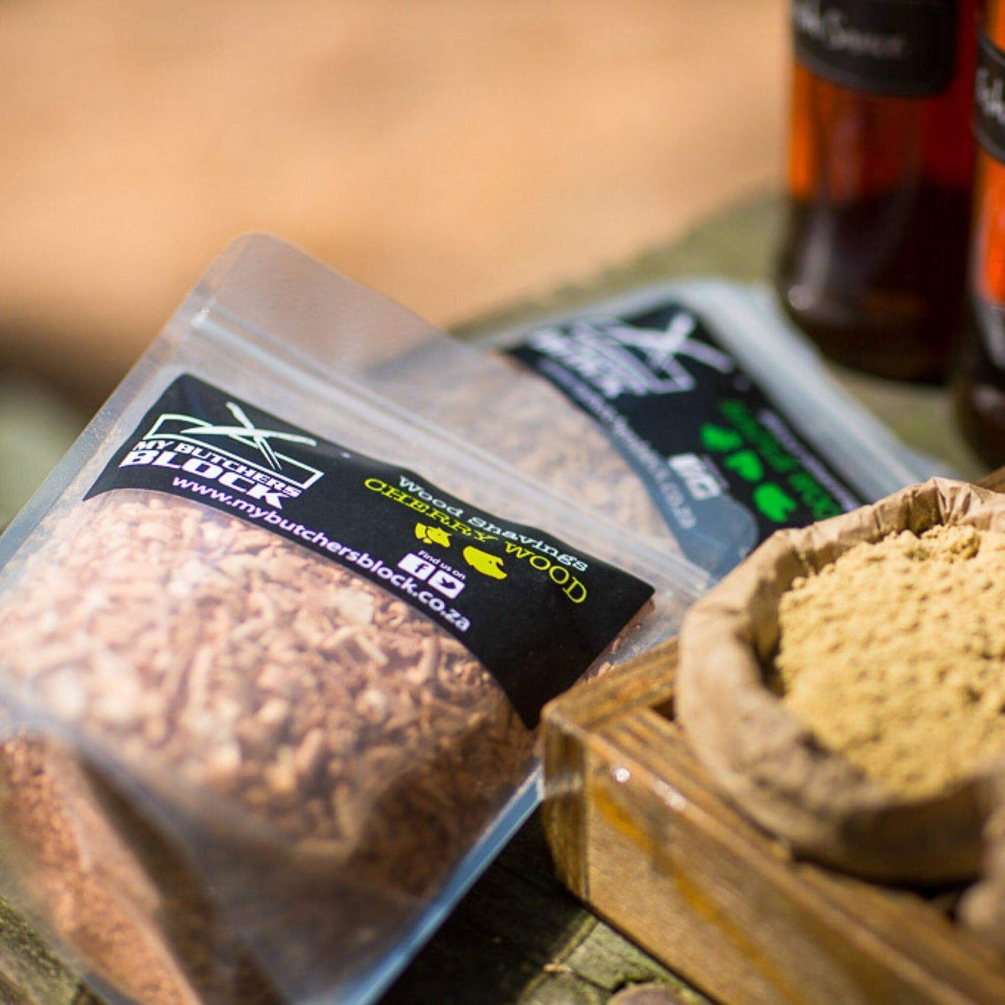 Premium smoking wood shavings in clear packaging, ready to enhance flavor for grilling and smoking.