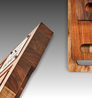 A collection of wooden kitchen cutting boards showcasing unique shapes and a polished finish.