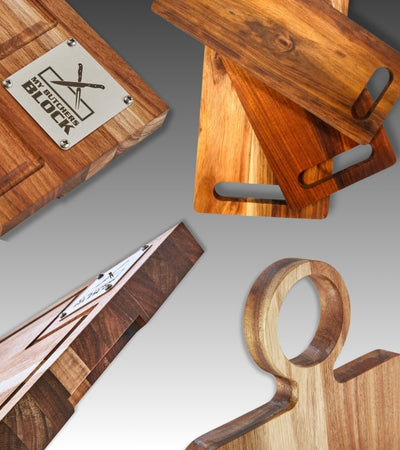 Various wood cutting boards and blocks showcasing unique designs and textures, ideal for cooking enthusiasts.