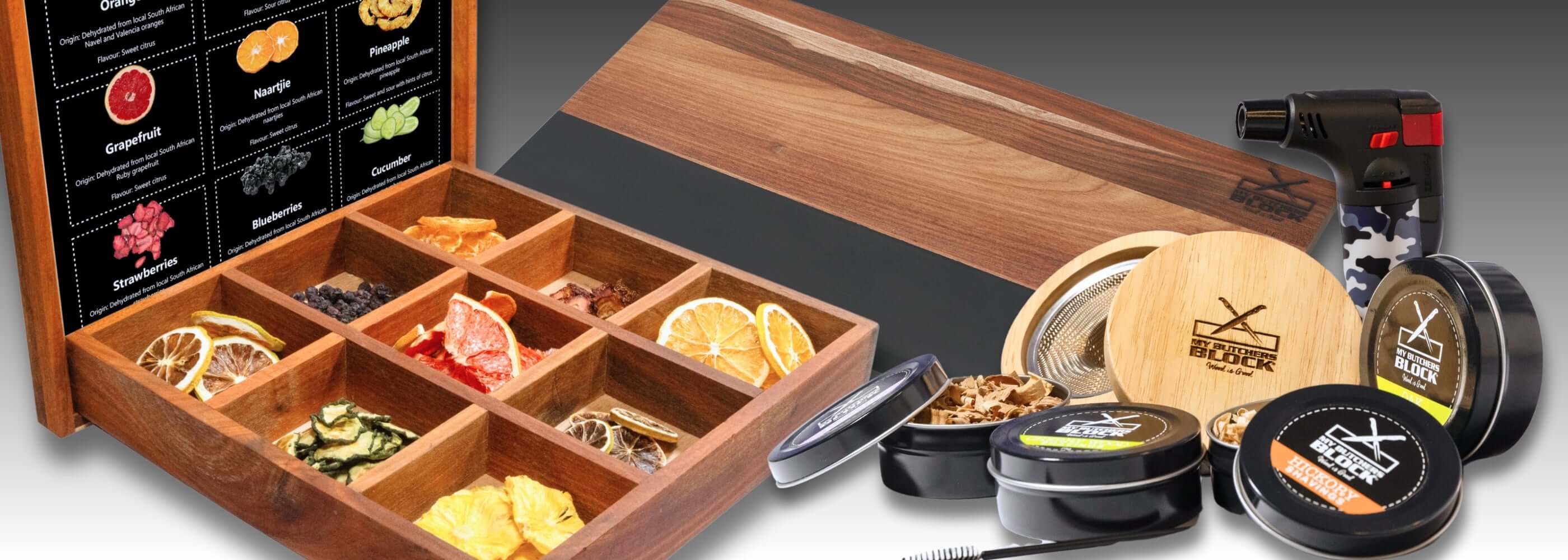 Wooden spice box with herbs, dried fruits, and a culinary torch, showcasing a variety of flavors for cooking.