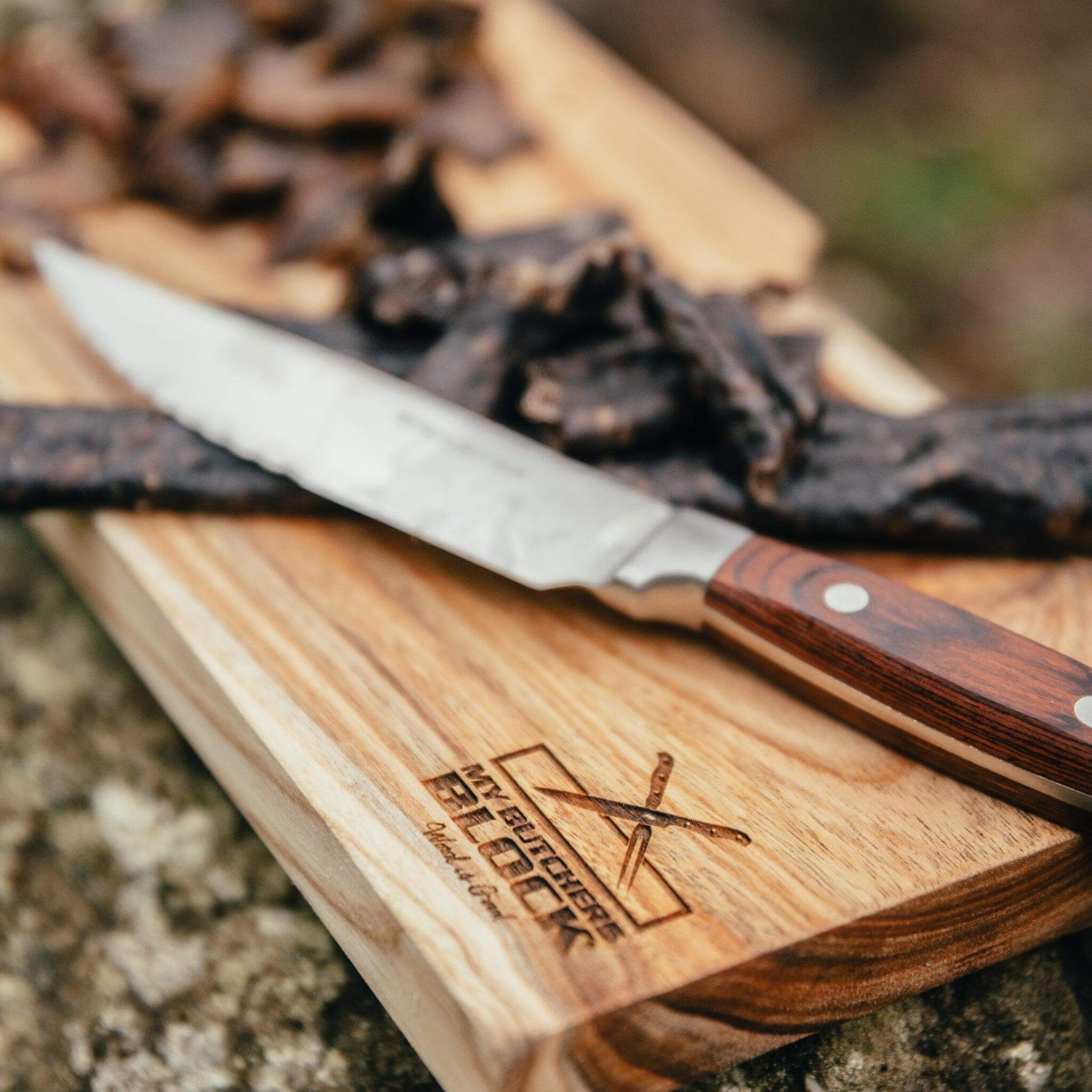 Close-up of Biltong Knife on the Board with biltong slices