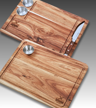 Wooden cutting boards with stainless steel bowls and a knife, ideal for food preparation and presentation.