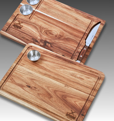 Wooden cutting boards with stainless steel bowls and a knife, ideal for food preparation and presentation.