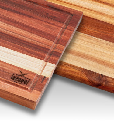 Two wooden cutting boards showcasing smooth, layered finishes and a logo, perfect for kitchen use.