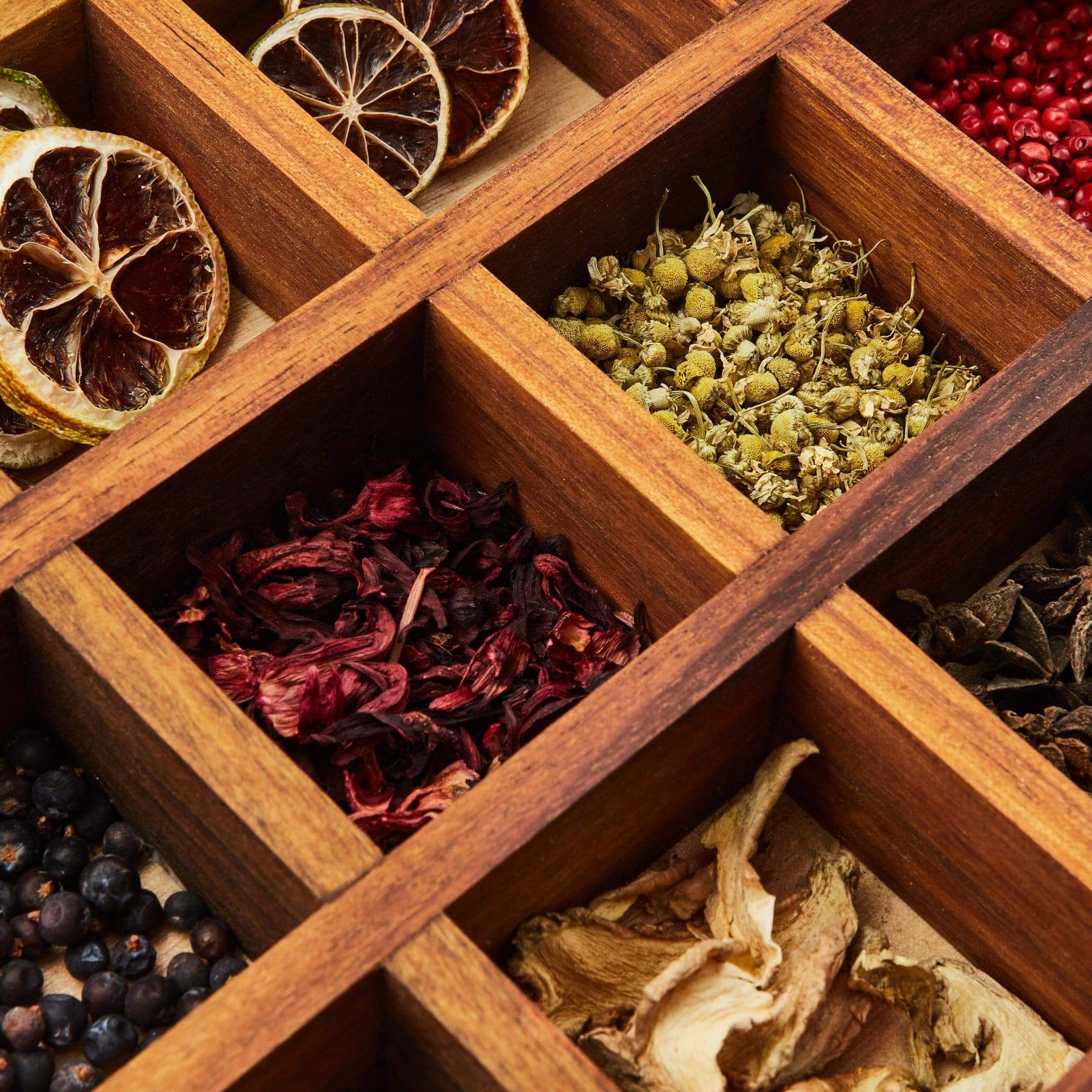 Close-up of dried citrus wheels, herbs, and spices in the Botanical Infusion Box.