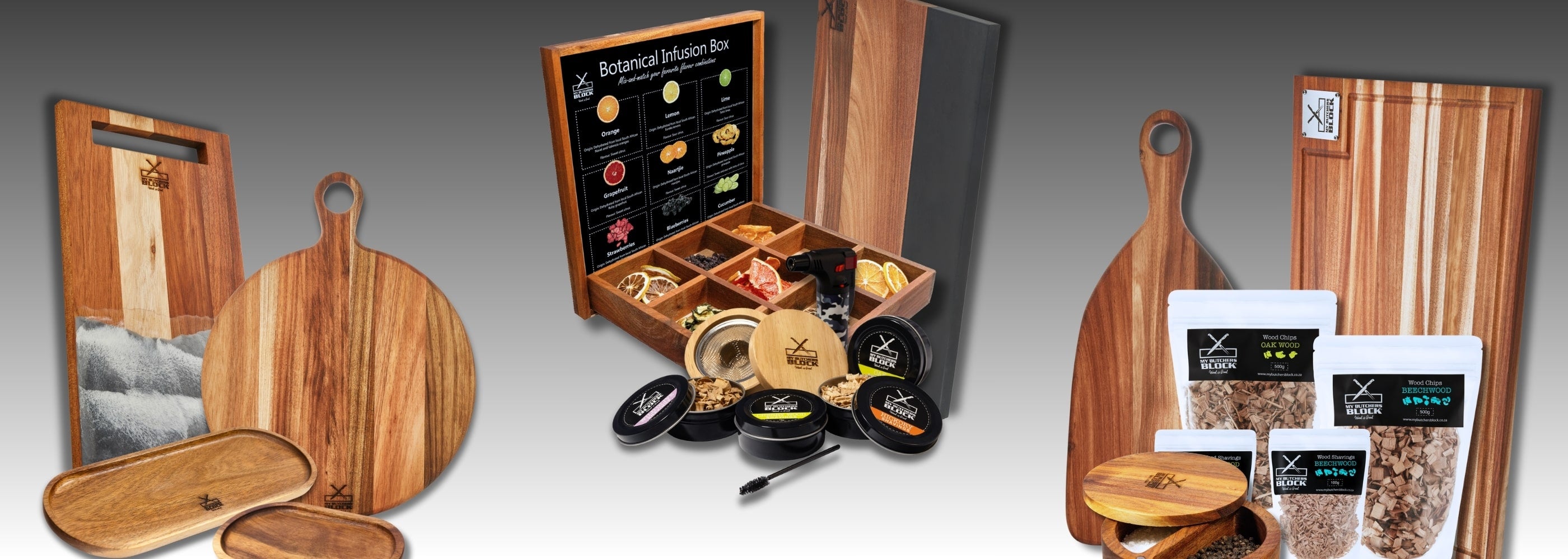 Collection of wooden serving boards and a spice set displayed on a gradient background.