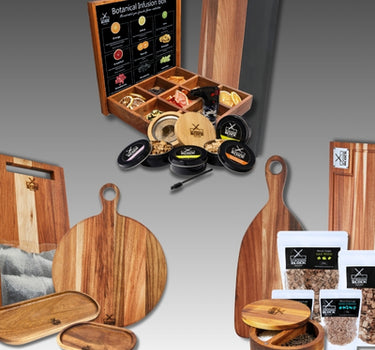 Botanical infusion box with wooden serving boards, spice jars, and assorted herbs, ideal for cooking enthusiasts.