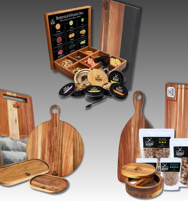 Botanical infusion box with wooden serving boards, spice jars, and assorted herbs, ideal for cooking enthusiasts.