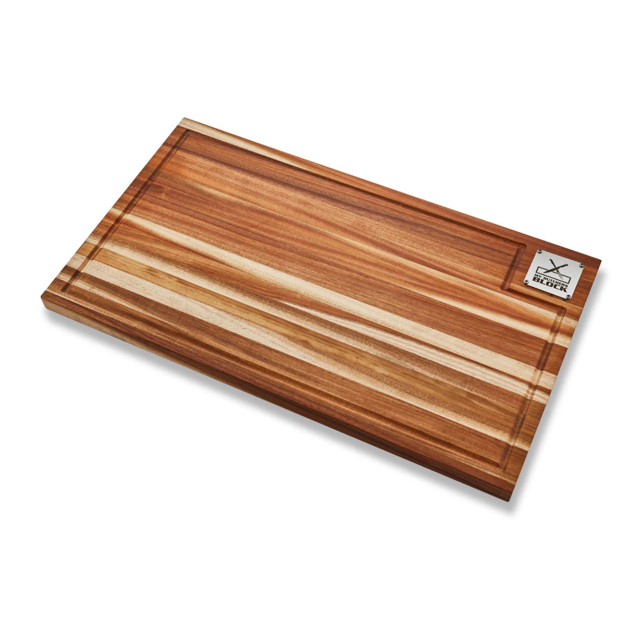 Grand Daddy Chopping Block made of solid acacia wood with juice groove and integrated handles for kitchen and braai.