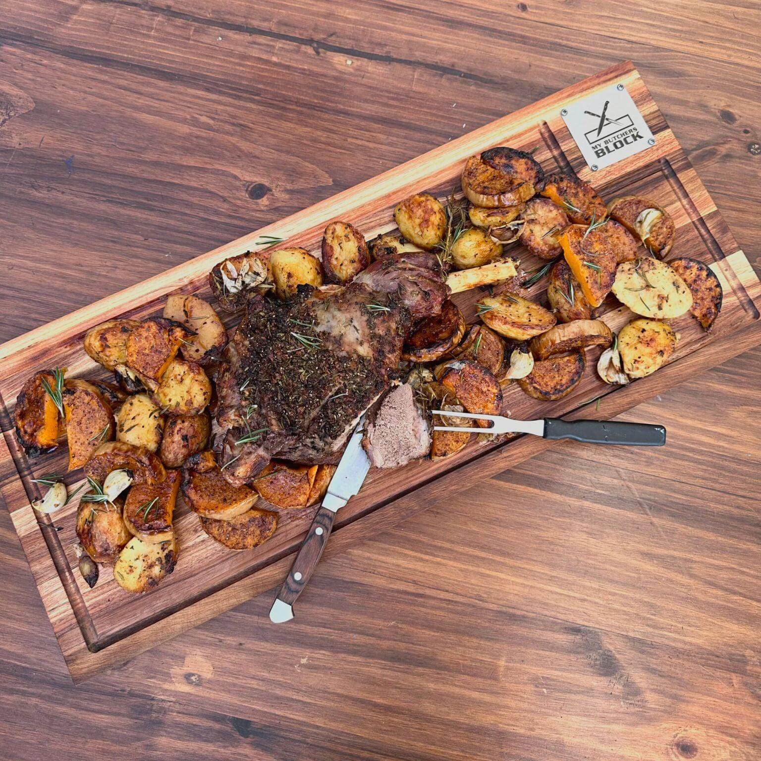 Grand Daddy Junior Chopping Block with roasted meat and seasoned potatoes, showcasing bold flavors and functional design.