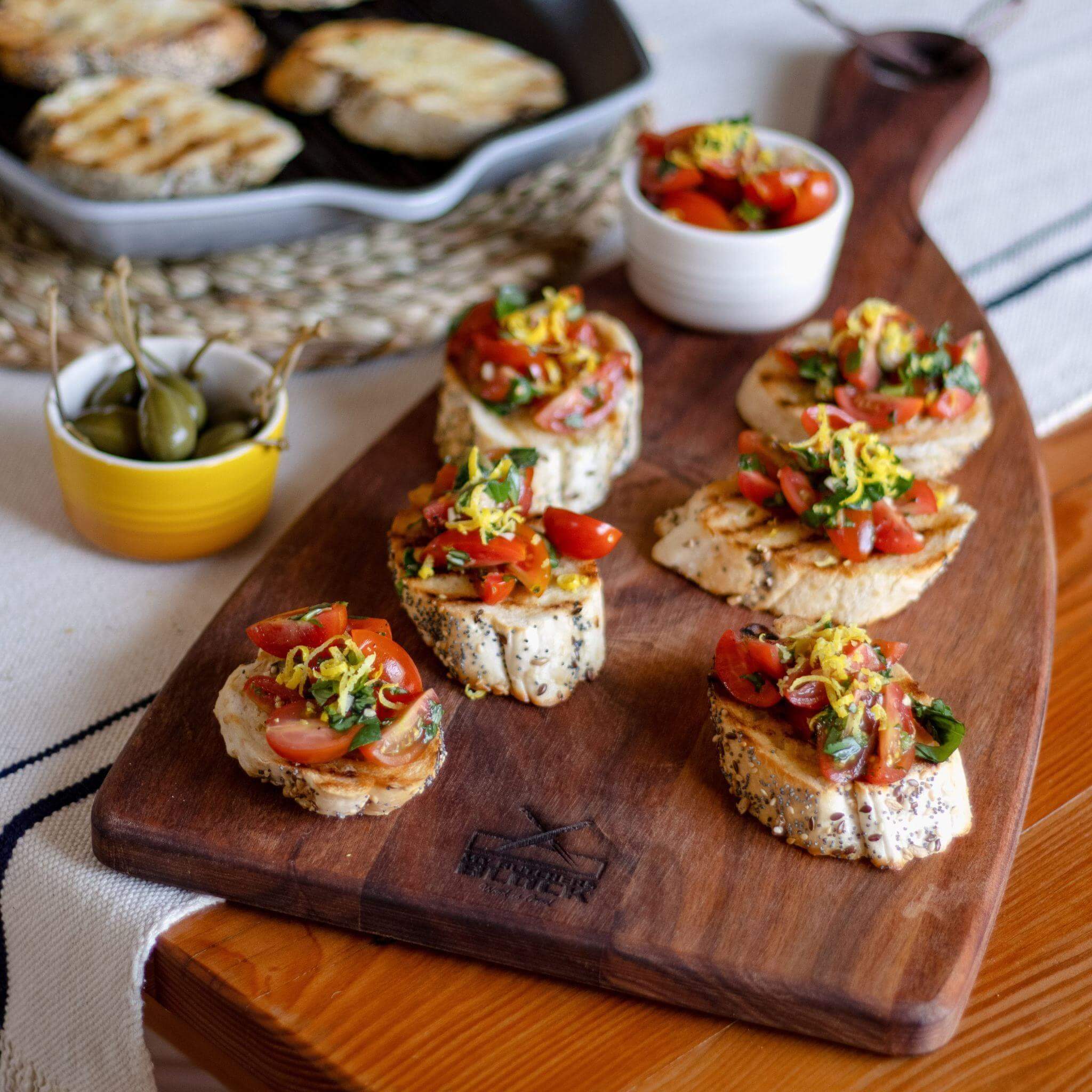 Large Cheeseboard in use, featuring a delicious spread of appetizers and cheese, perfect for serving guests.