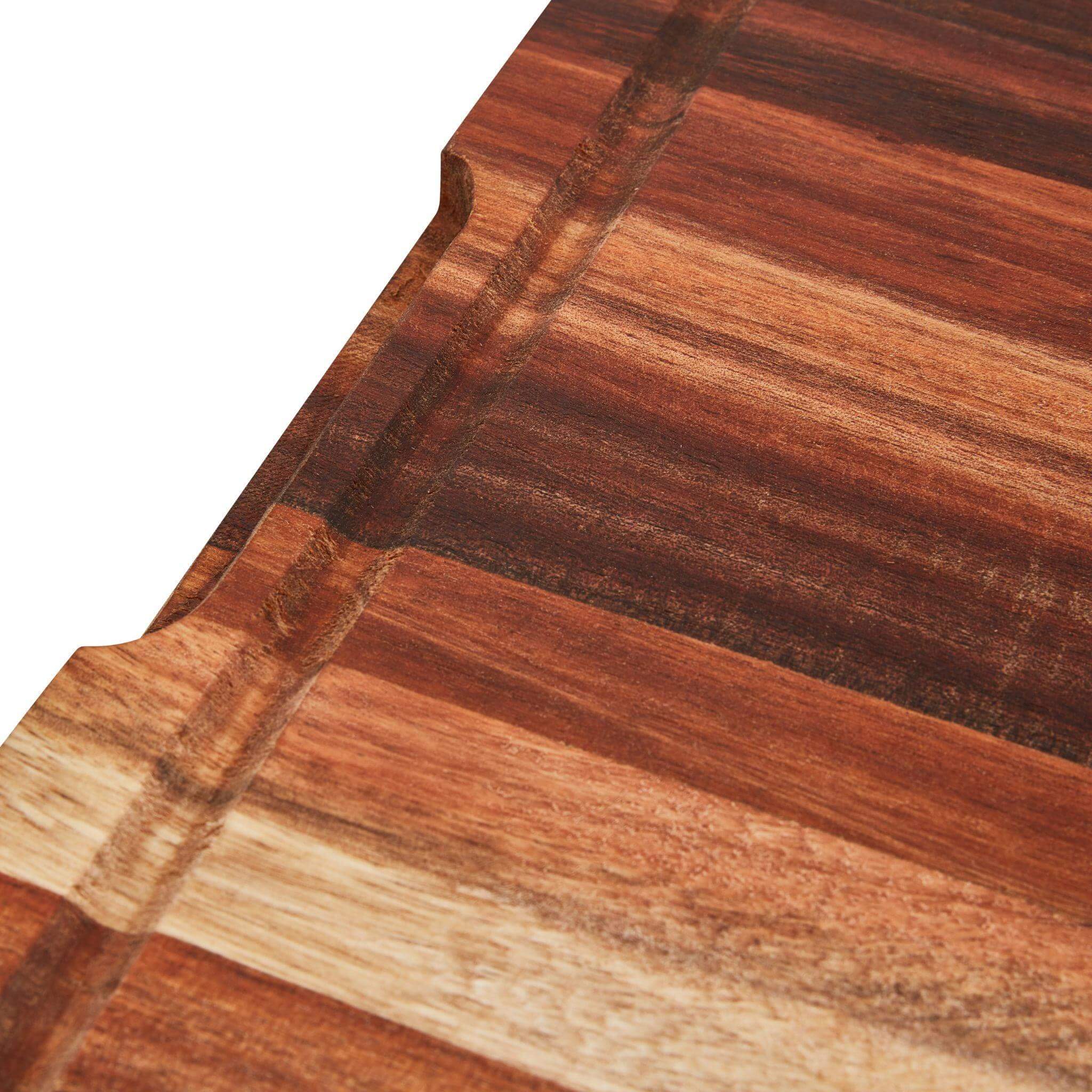 Close-up of the Large Slim Chopping Block showcasing its beautiful wood grain and ergonomic handle cutouts.