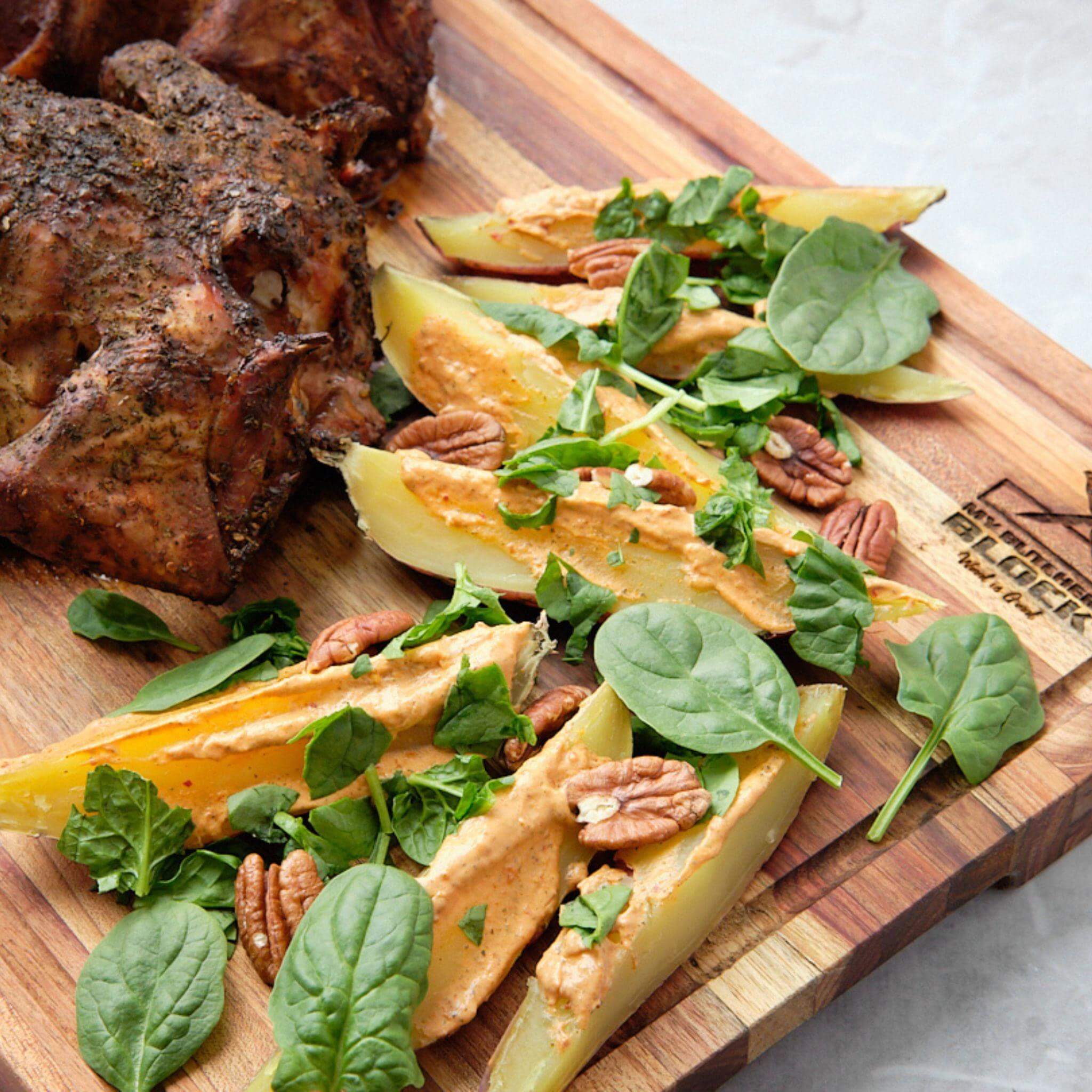 Large Slim Chopping Block with sliced vegetables, spinach, pecans, and cooked chicken dinner.