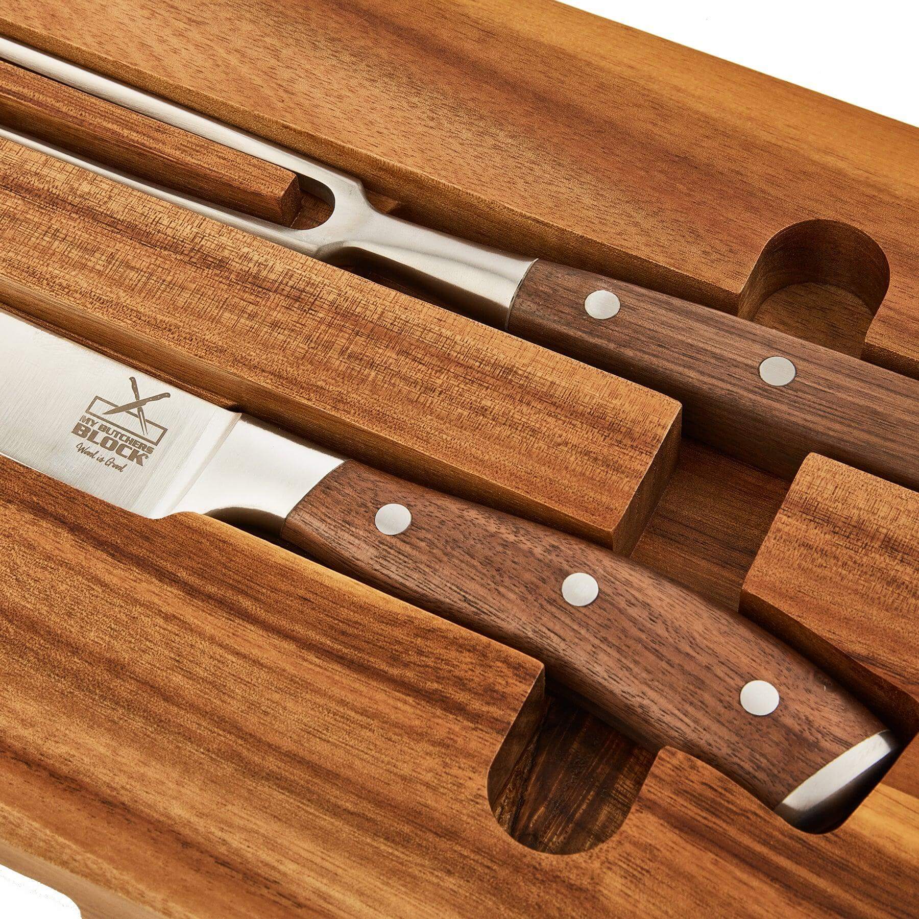 Chopping board and carving knife set with wooden handles in a sleek design, perfect for kitchen enthusiasts.