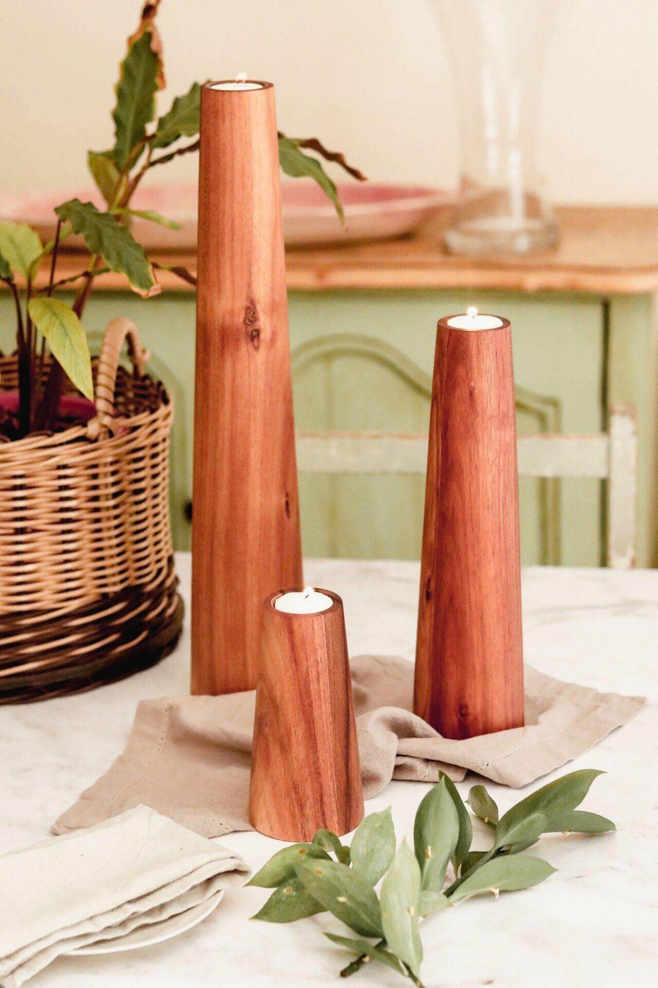 Large Blackwood candlestick holders in rustic decor, perfect for a minimalist Scandi-chic home.