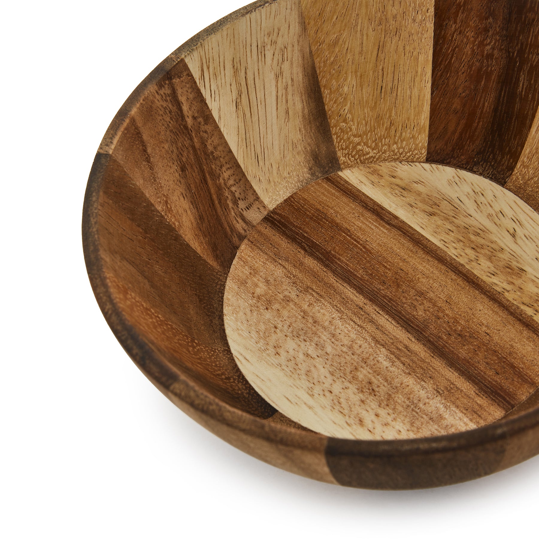 Close-up of a handcrafted small wooden bowl showing its unique natural finish and patterned design.