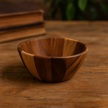 Handcrafted small wooden bowl with a natural finish, perfect for snacks and sauces, resting on a wooden table.