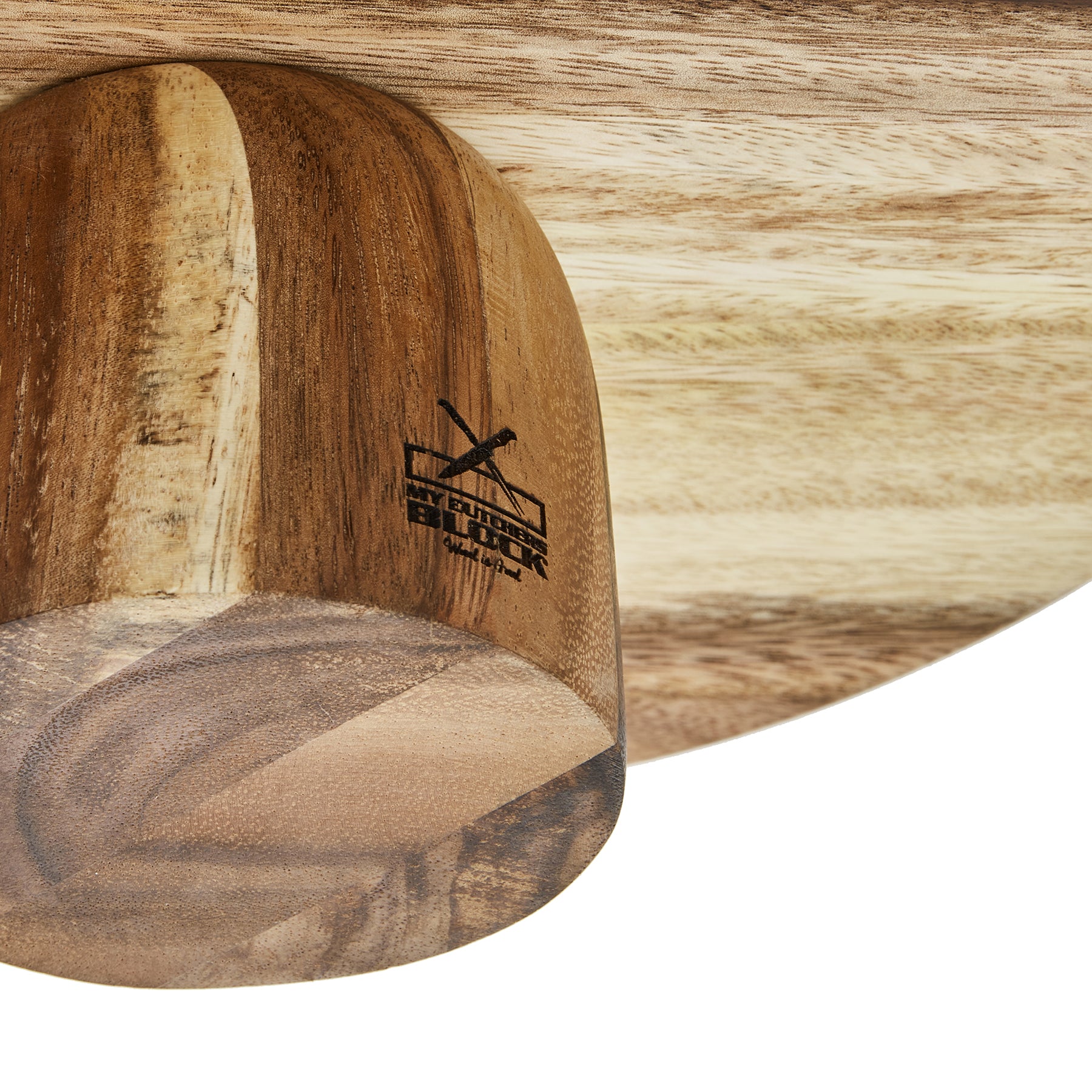 Close-up of a handcrafted wooden cake stand showing natural wood grain and brand logo.