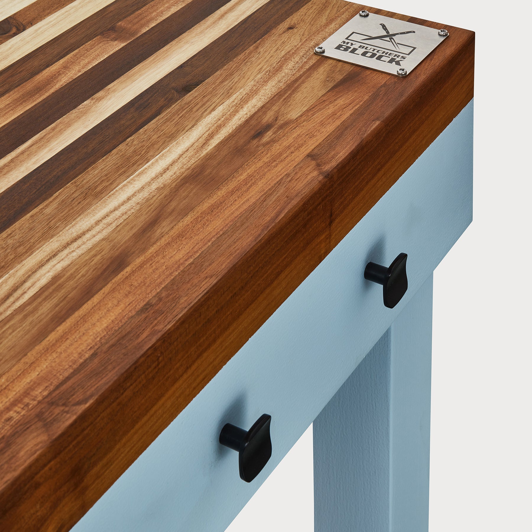 Butcher's Bench with solid wood top and drawer handles, showcasing durability and modern design.