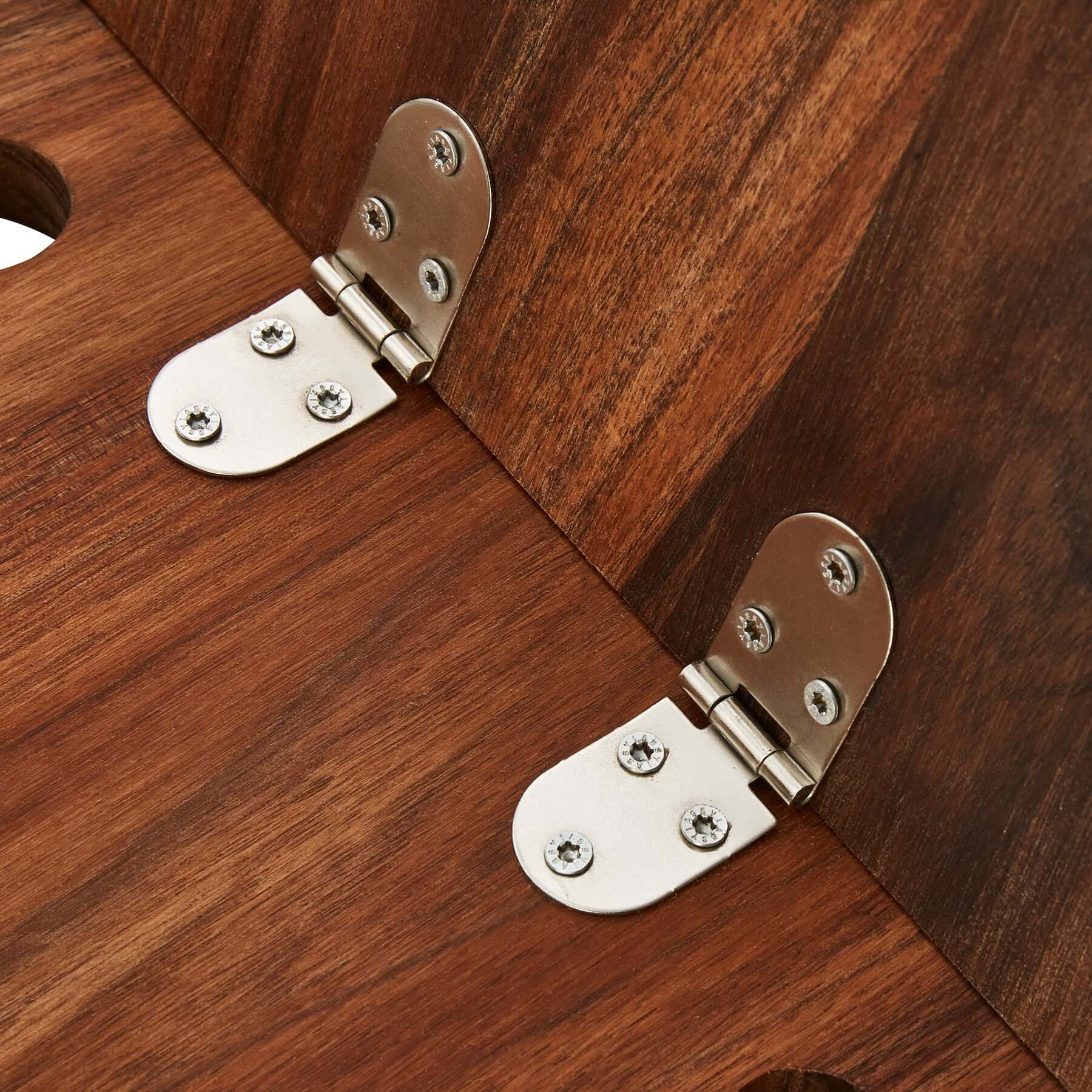 Close-up of durable metal hinges on a wooden grazing table, showcasing its premium craftsmanship and functionality.