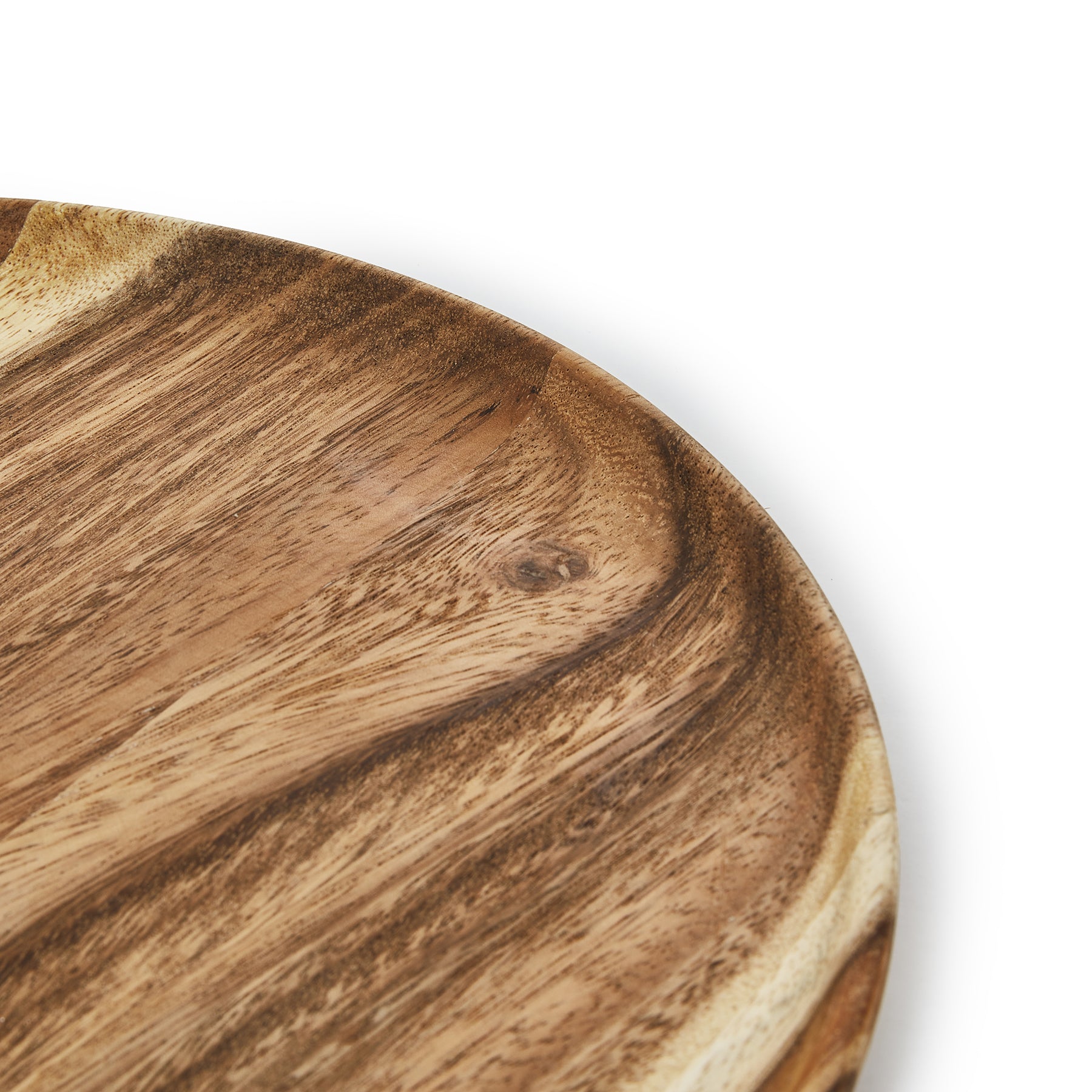 Close-up of a round wooden dinner plate showcasing handcrafted Acacia wood texture and natural finish.