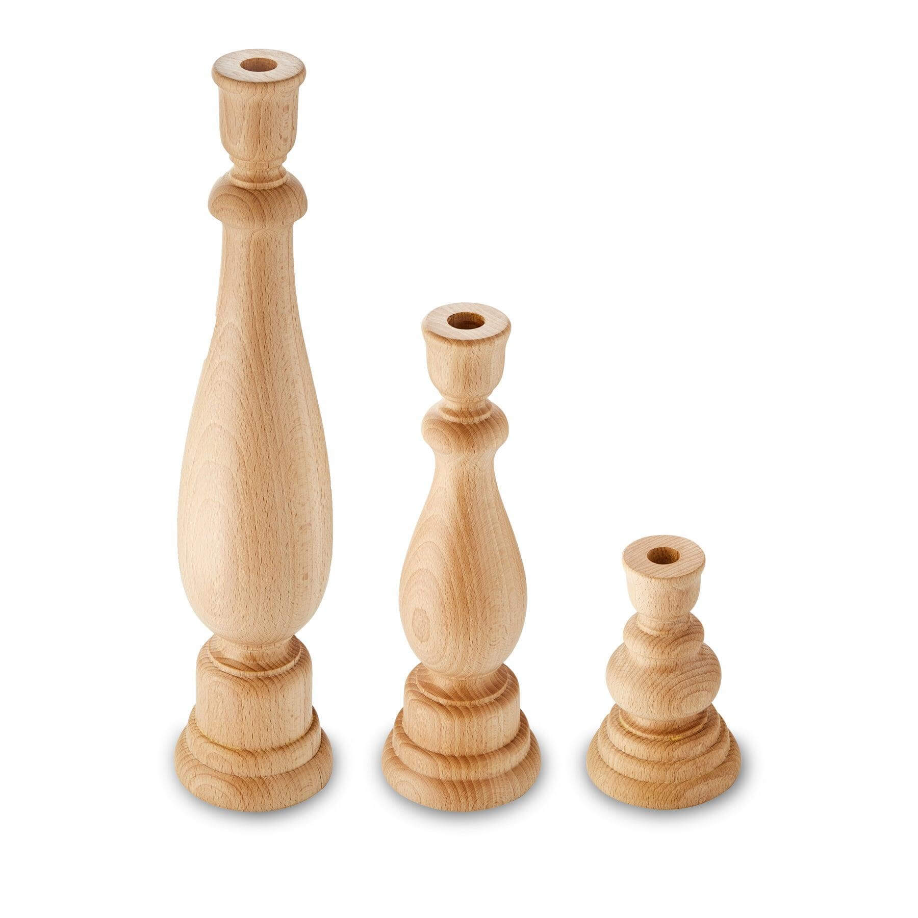 Set of three solid beechwood candlesticks showcasing rustic charm and minimalist design.