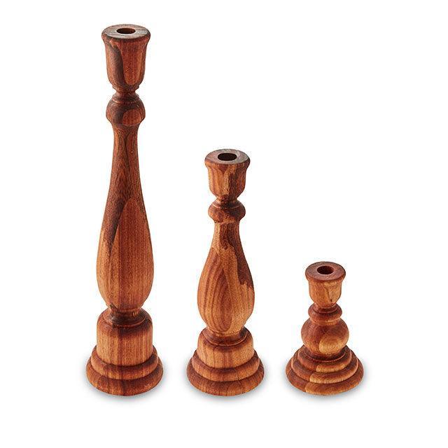 Set of three rustic solid Blackwood candlesticks in various heights, showcasing mid-century-inspired design.
