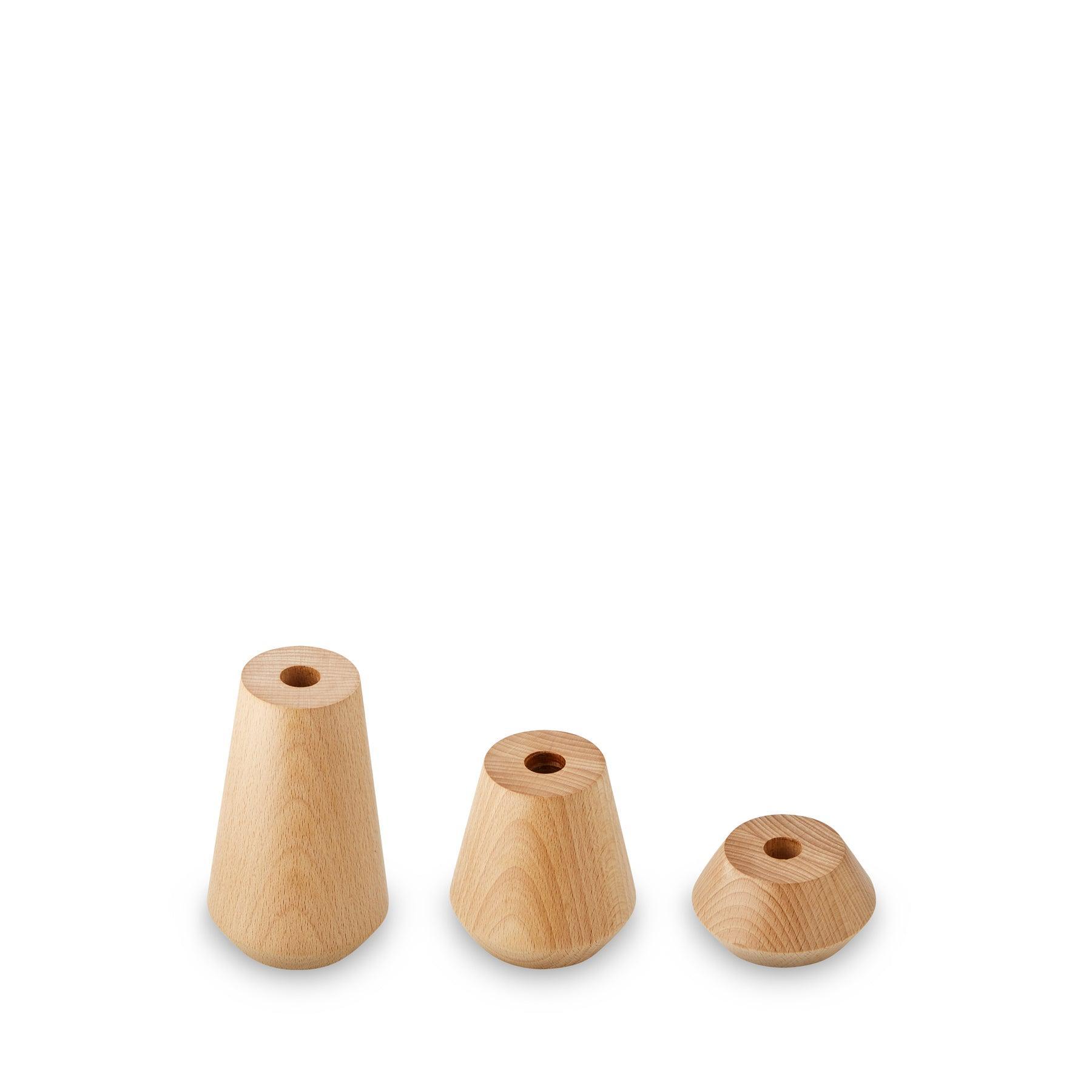 Rustic solid Beechwood candle holders in various shapes, perfect for minimalist Scandi-chic decor.