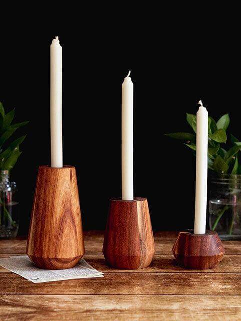 Rustic solid Blackwood candle holders in medium size, featuring three unique shapes with white candles, perfect for stylish decor.