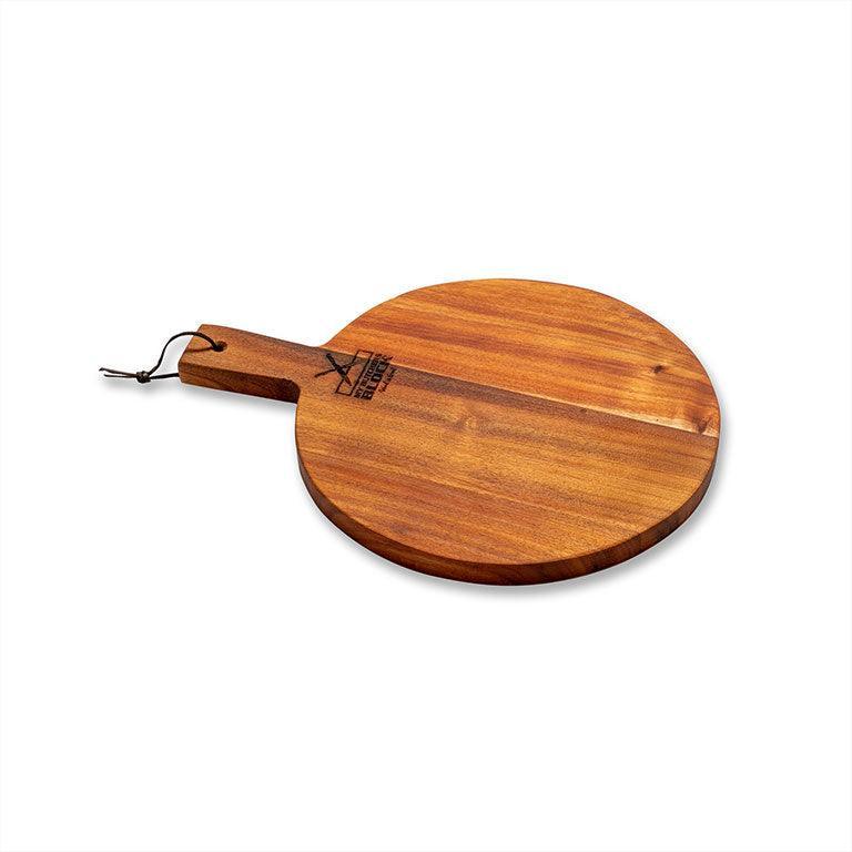 Round medium old design pizza serving board crafted from Knysna Blackwood, sustainably sourced.