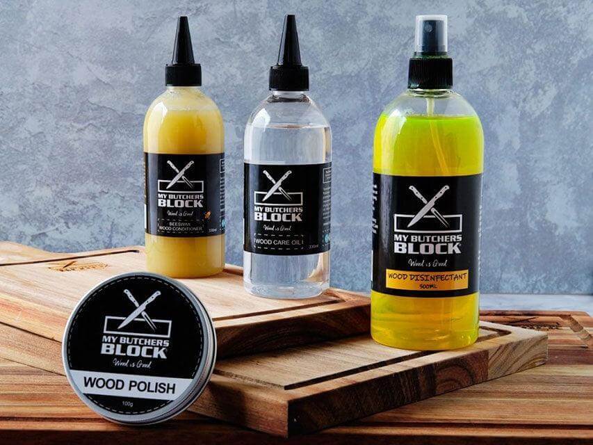 My Butchers Block wood care products on a wooden surface, including wood polish, mineral oil, and wood protectant.