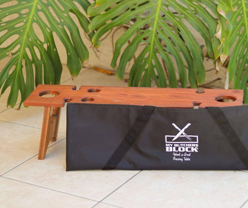 Foldable Grazing Table by My Butchers Block with carrying bag, ideal for outdoor picnics and adventures.