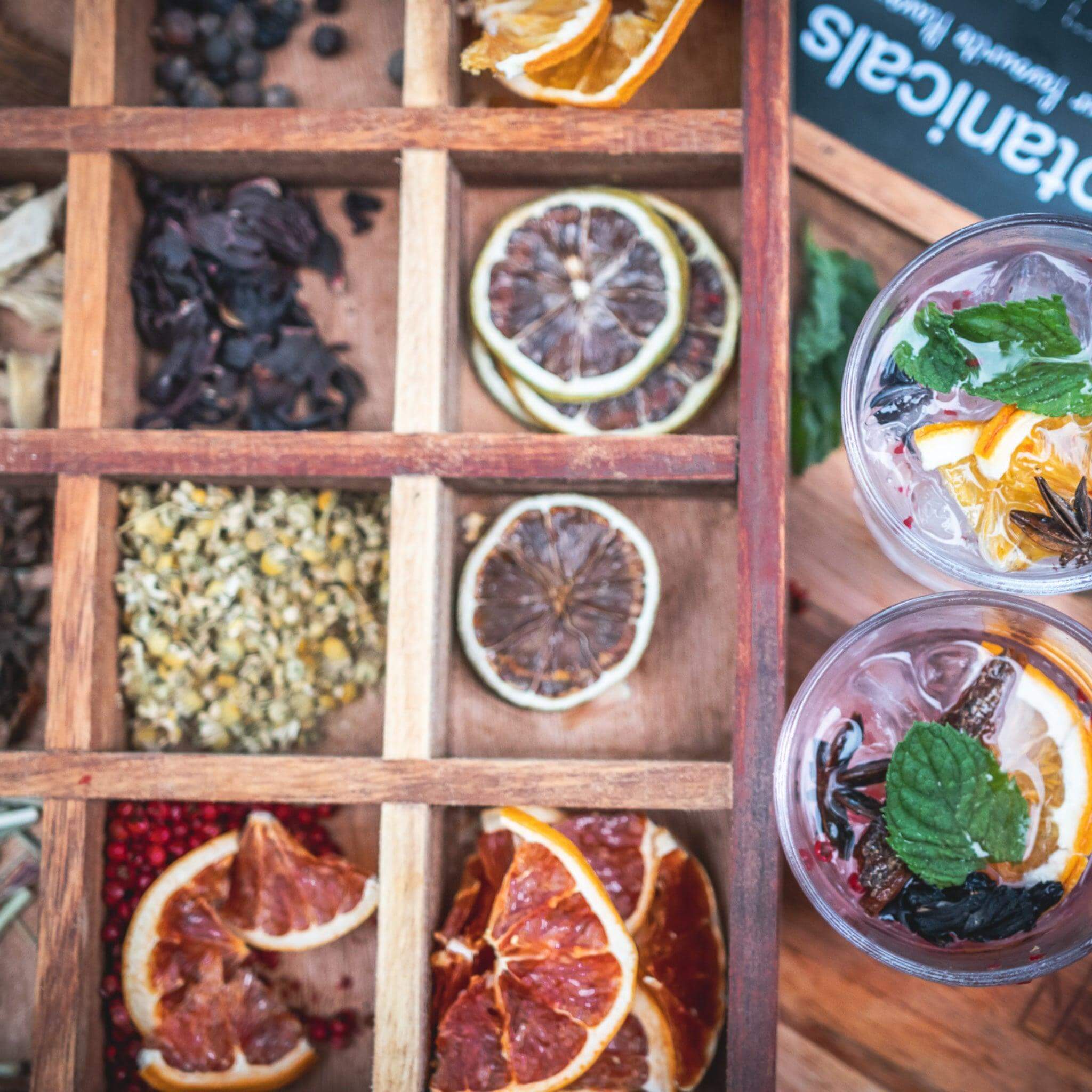 Overhead view of the Botanical Infusion Box with fresh drinks, highlighting the variety of botanicals.