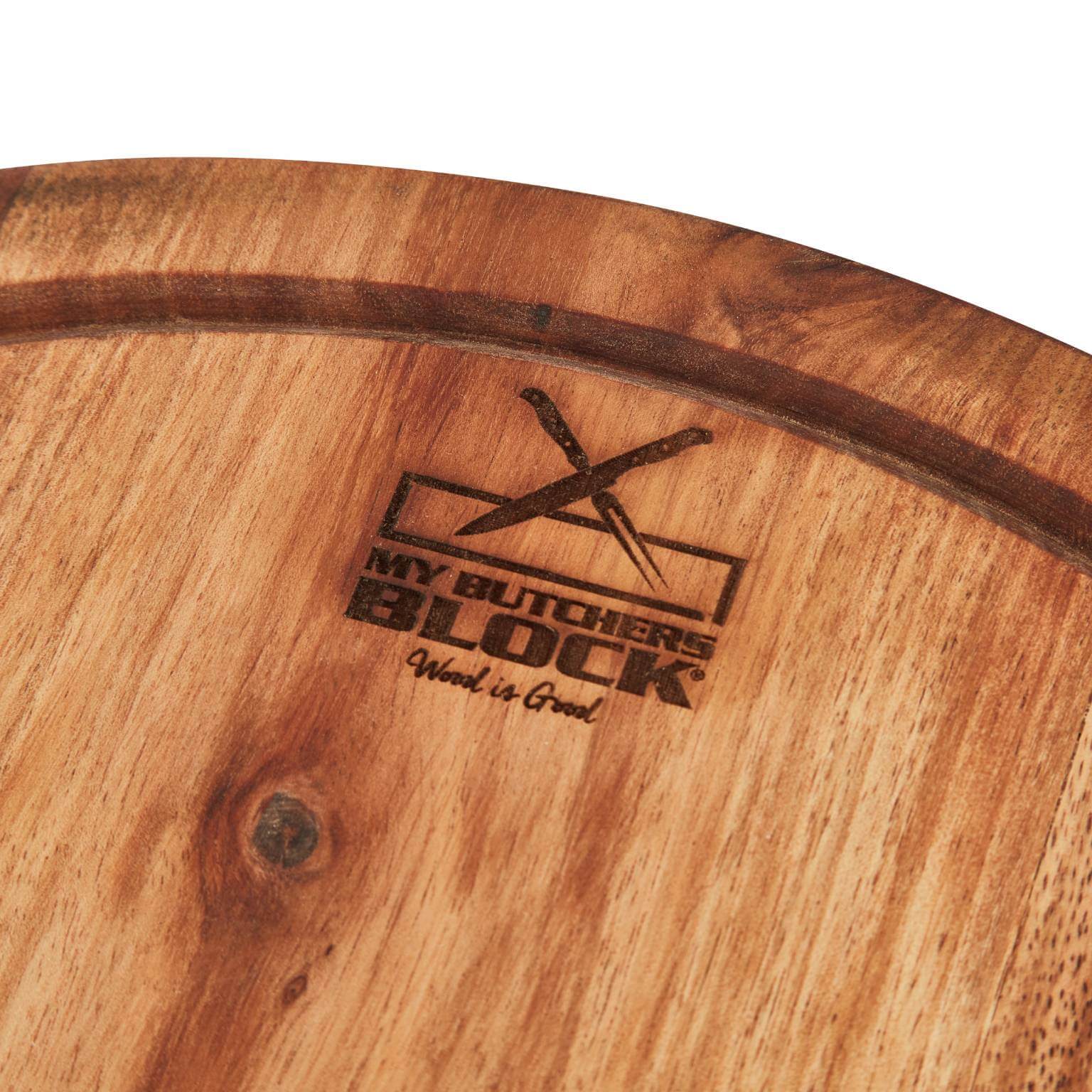 Close-up of a wooden chopping board engraved with My Butcher's Block logo, showcasing quality craftsmanship.