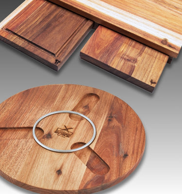 Set of wooden cutting boards featuring a round board and rectangular designs, showcasing natural wood grains.