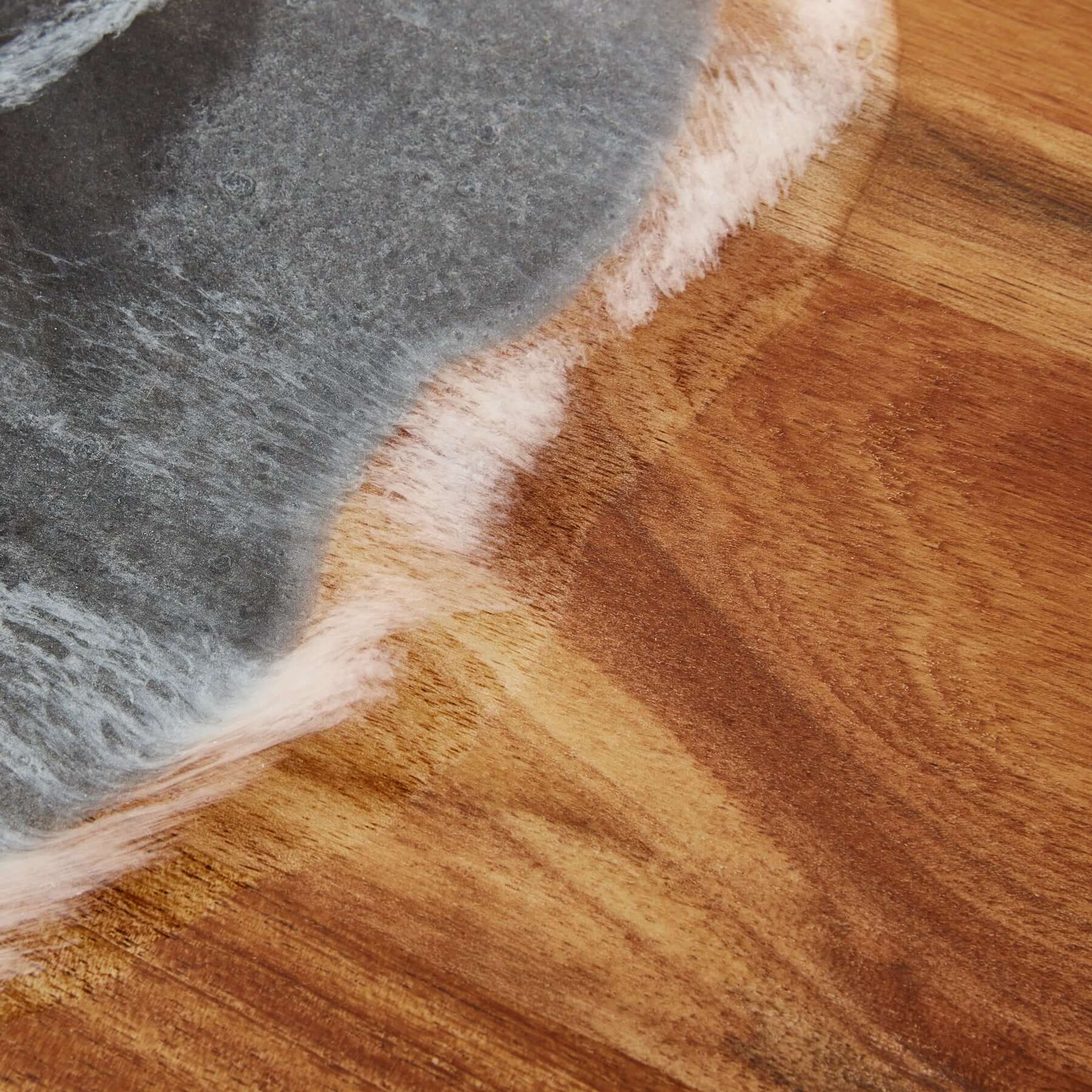Close-up of the Handy Andy In Black Resin showing the elegant wood surface and unique texture perfect for serving.