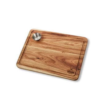 Premium wooden steak board with built-in serving cup for exceptional steak presentation.