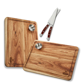 Premium wooden steak boards with stainless steel cups and gourmet steak knives for the perfect meal presentation.