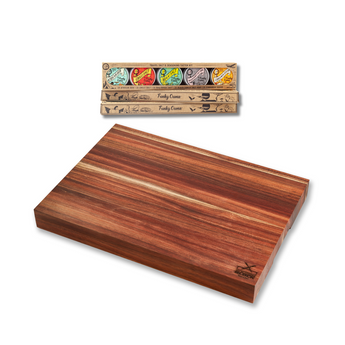 Large wooden chopping block with Funky Ouma seasoning taster kit, ideal for slicing and seasoning in South African kitchens.