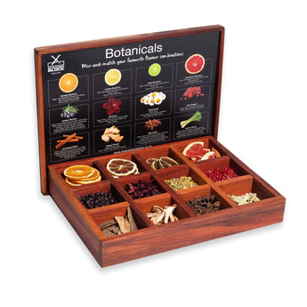 Open Botanical Infusion Box showcasing a variety of dried fruits, herbs, and spices.