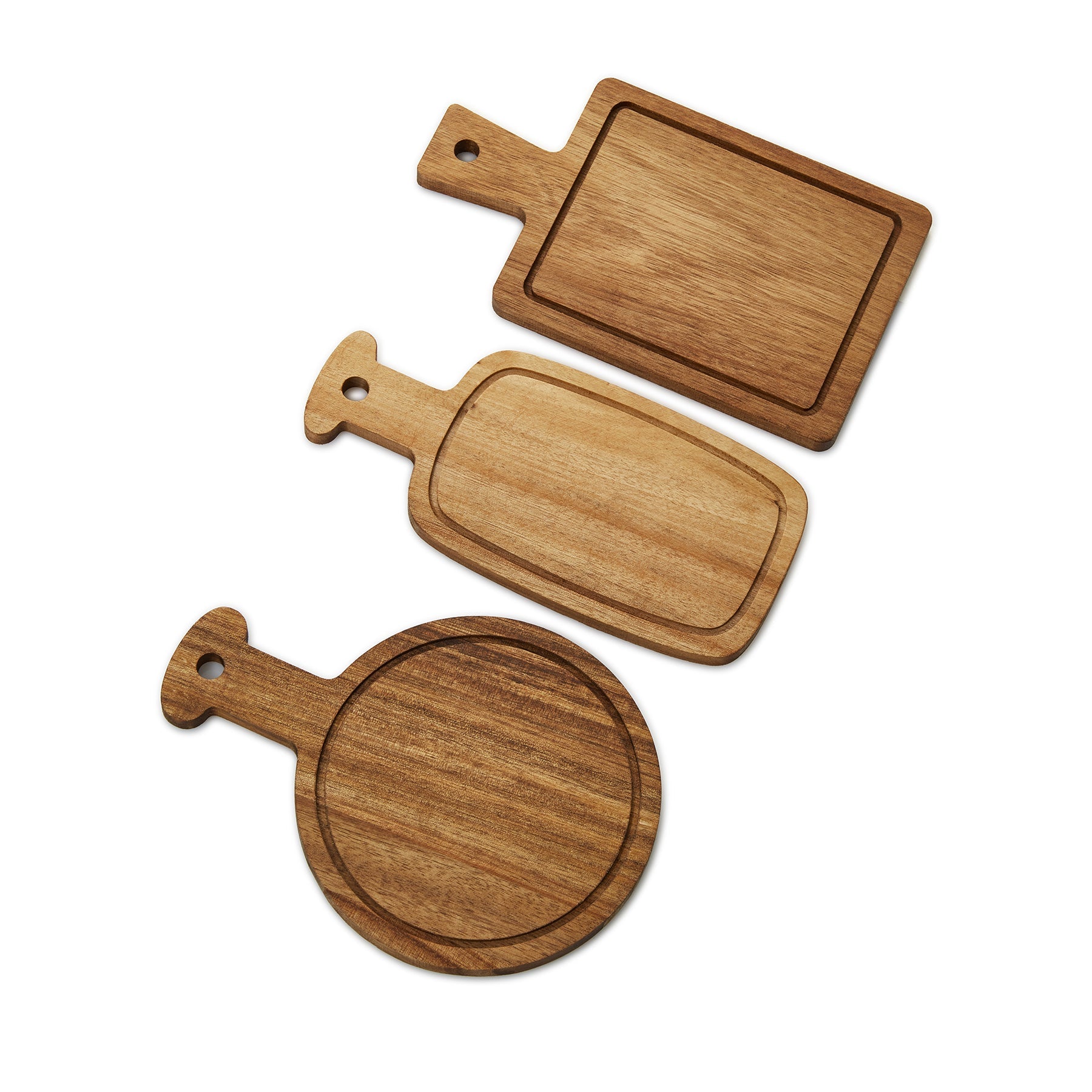 Three wooden serving boards in different shapes with integrated handles and hanging holes.