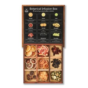 Fruity Botanical Infusion Box displaying nine different dried botanicals and fruits in a wooden box.